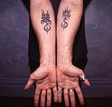 scorpion_eyes_tats.jpg